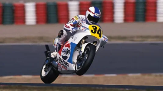 Kevin-Schwantz-lifts-the-front-wheel-of-his-Suzuki-at-Suzuka-1988-800x450.webp